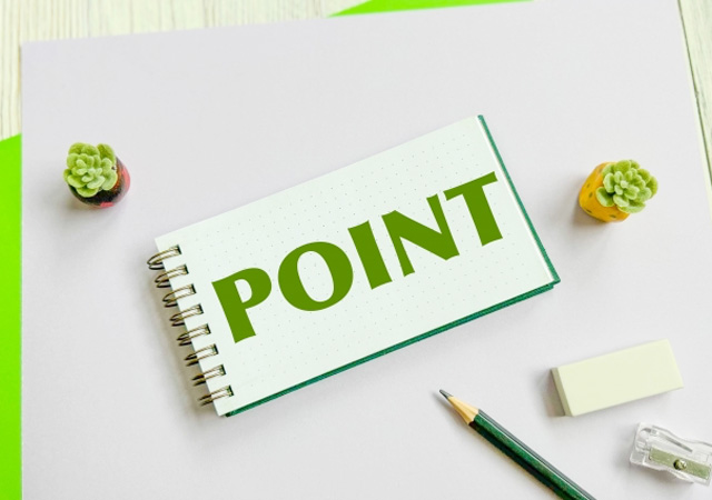 POINTと書かれたノートと鉛筆が置いてある画像